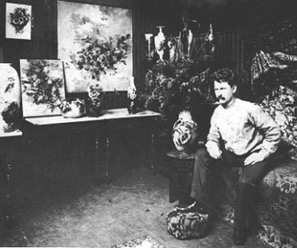 Photo Franz Bischoff in studio with paintings of roses