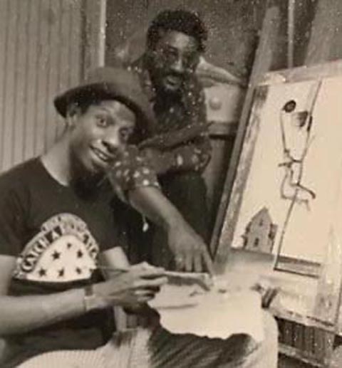 Ernie Barnes assisting Jimmy Walker what it is like to handle brushes and do battle with an empty canvas. 