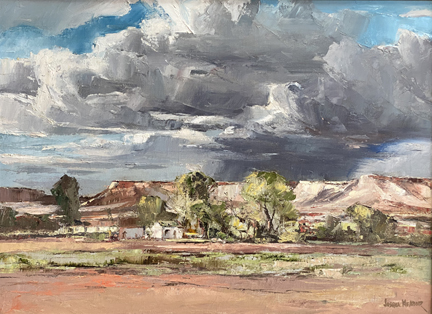 Joshua Meador, South Nevada #1923, (authentication verso with estate stamp signature, a desert scene and distant hills with dominant cumulouos clouds overhead.